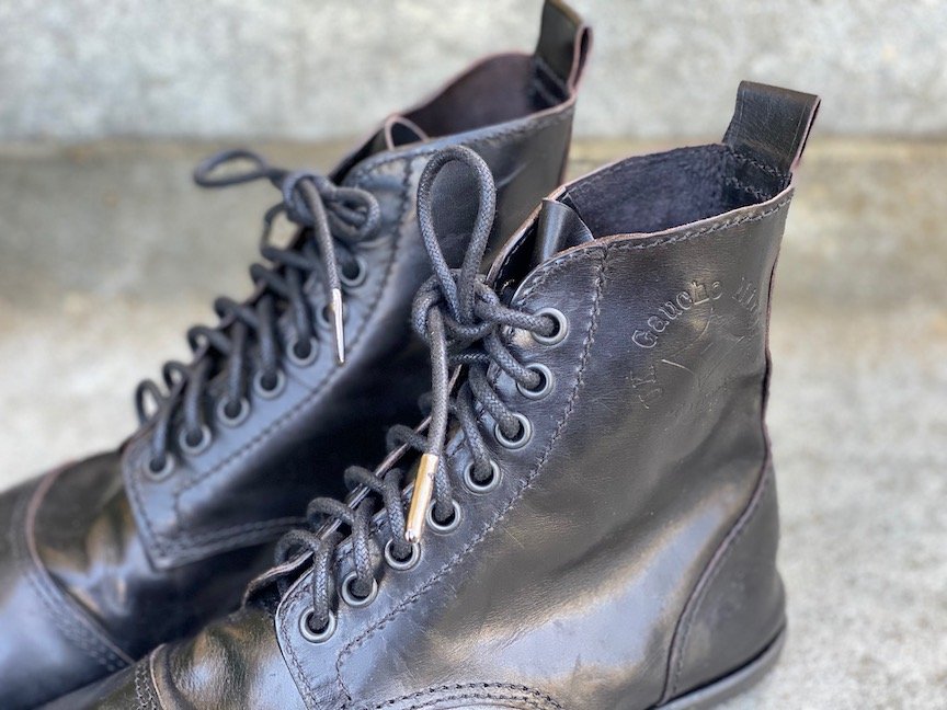 close up of the logo and laces on a Gaucho ninja desert blaster barefoot handmade boot