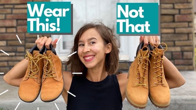 An image of a woman holding up two pairs of boots, the Groundies Liverpool barefoot boots and Timberlands with the text "wear this! Not That" over the top