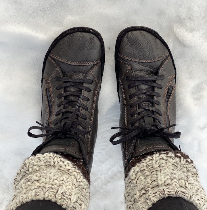 Top view of a woman's feet in Magical Alaskan barefoot winter boots in brown leather