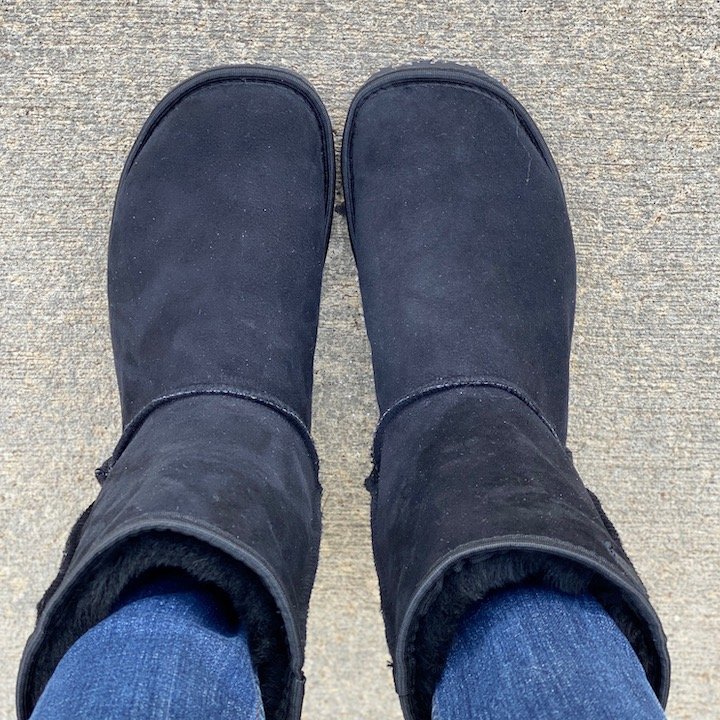 Top view of a pair of feet in Zeazoo Dingo sheepskin lined barefoot black boots