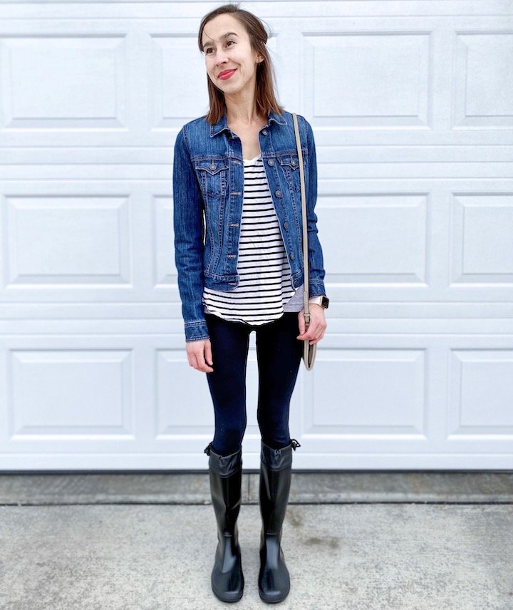 A woman in a striped shirt and jean jacket wearing a pair of Asgard Rainboots