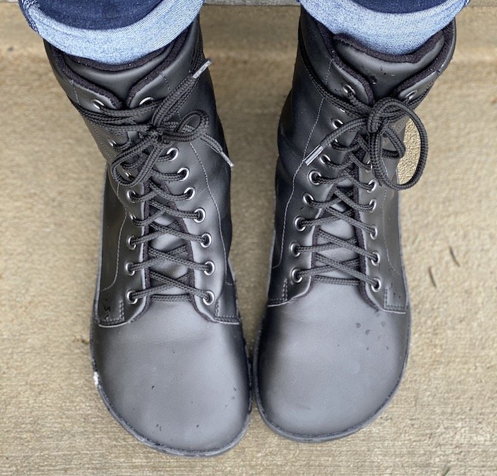 Top down view of a pair of feet wearing Ahinsa Jaya Black Vegan Barefoot Combat Boots