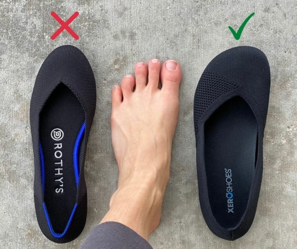 A woman's bare foot between two similar black knit flats - Rothy's and Xero Phoenix barefoot ballet flat. There is a green check over Xero and a red x over Rothy's.