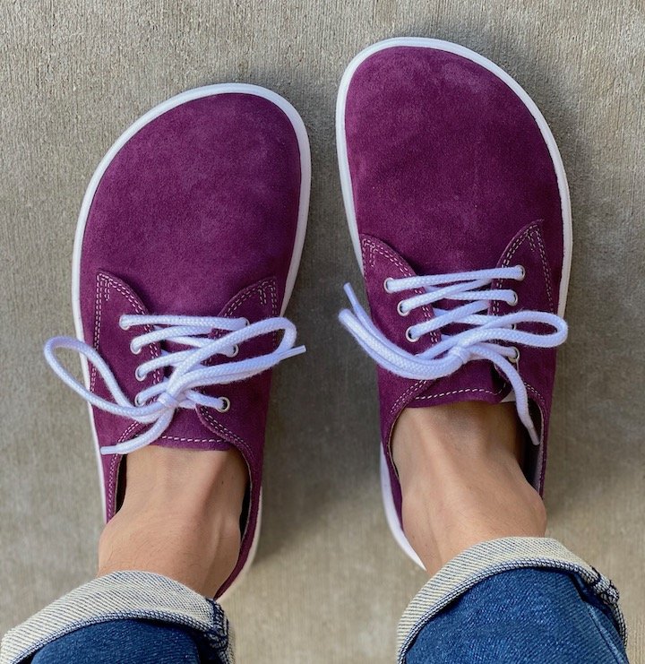 A stunning pair of plum Be Lenka City sneakers with white outsoles and laces.te outsole and white laces.