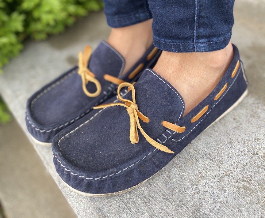 Close up angled view of Zeazoo Cheetah barefoot moccasin style loafers in navy. They are very lightweight and flexible.