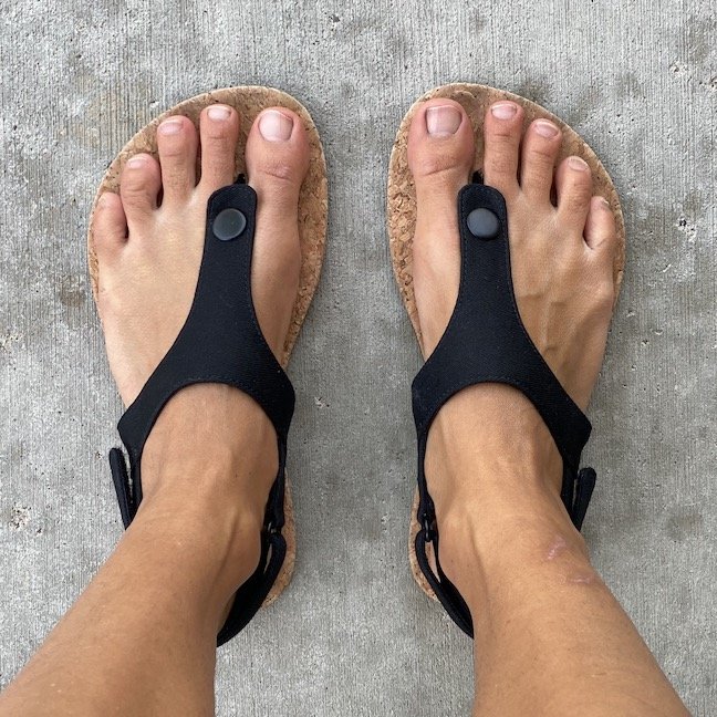 Top down view of Feelgrounds barefoot seaside sandals in black