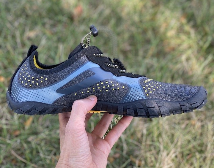 an unworn Saguaro amazon water shoe being held up to show the side profile