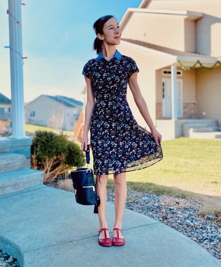 A woman wearing a dress and red Zlatush T Strap Flats, best barefoot dress shoes for women