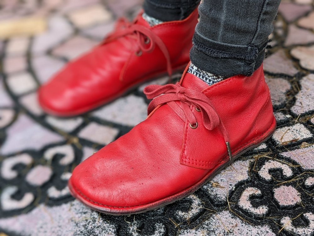 Front Angle view of red leather barefoot desert handmade boots by Gaucho Ninja brand Barefoot Pals ethically produced in Guatemala