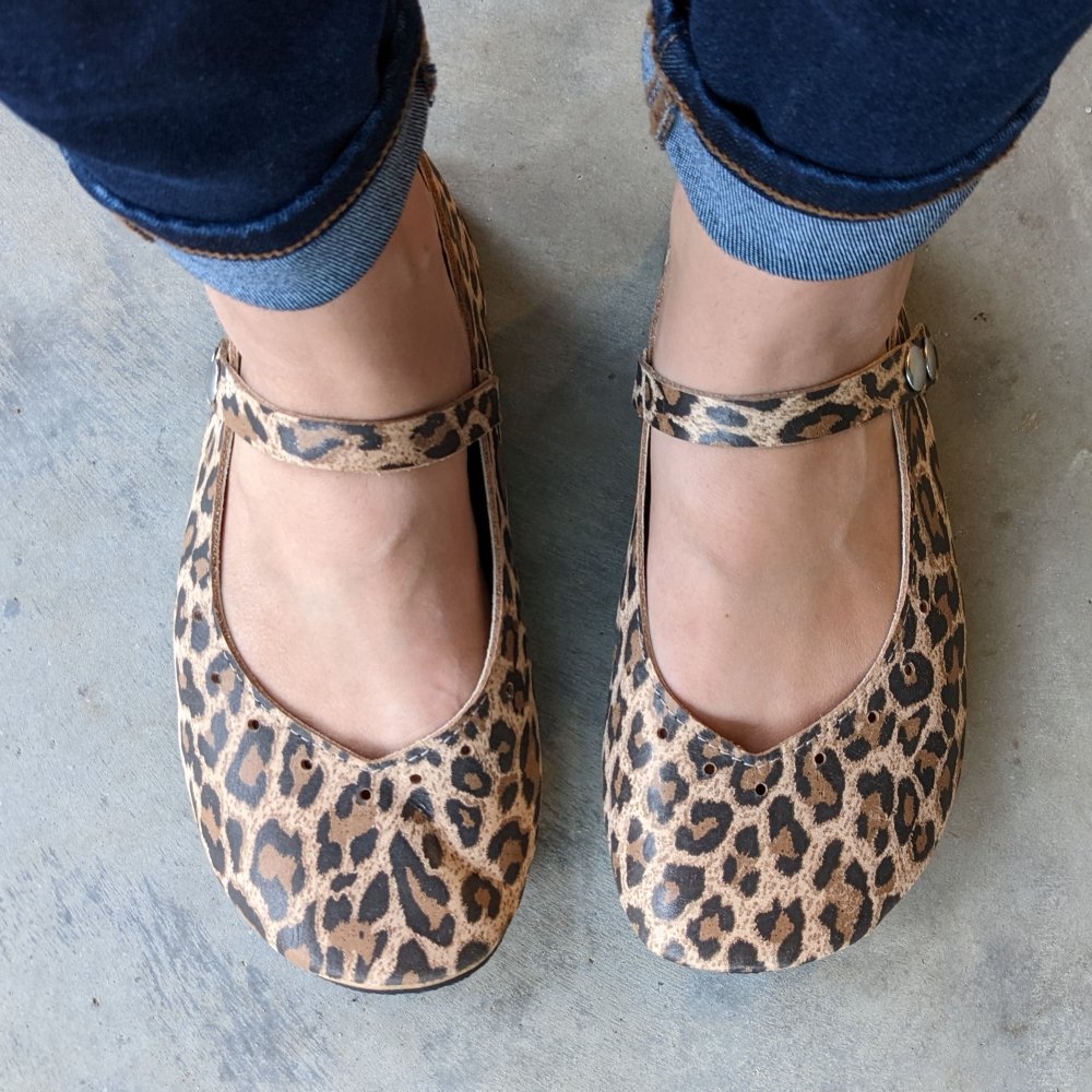 Top Down view of a woman's feet in cuffed skinny jeans wearing Duchess and Fox leather handmade in the USA Mary Janes with super flexible zero drop sole