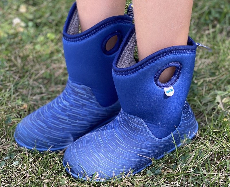 A close up of a child's feet wearing Jan & Jul affordable Toasty Dry Lite waterproof winter boots