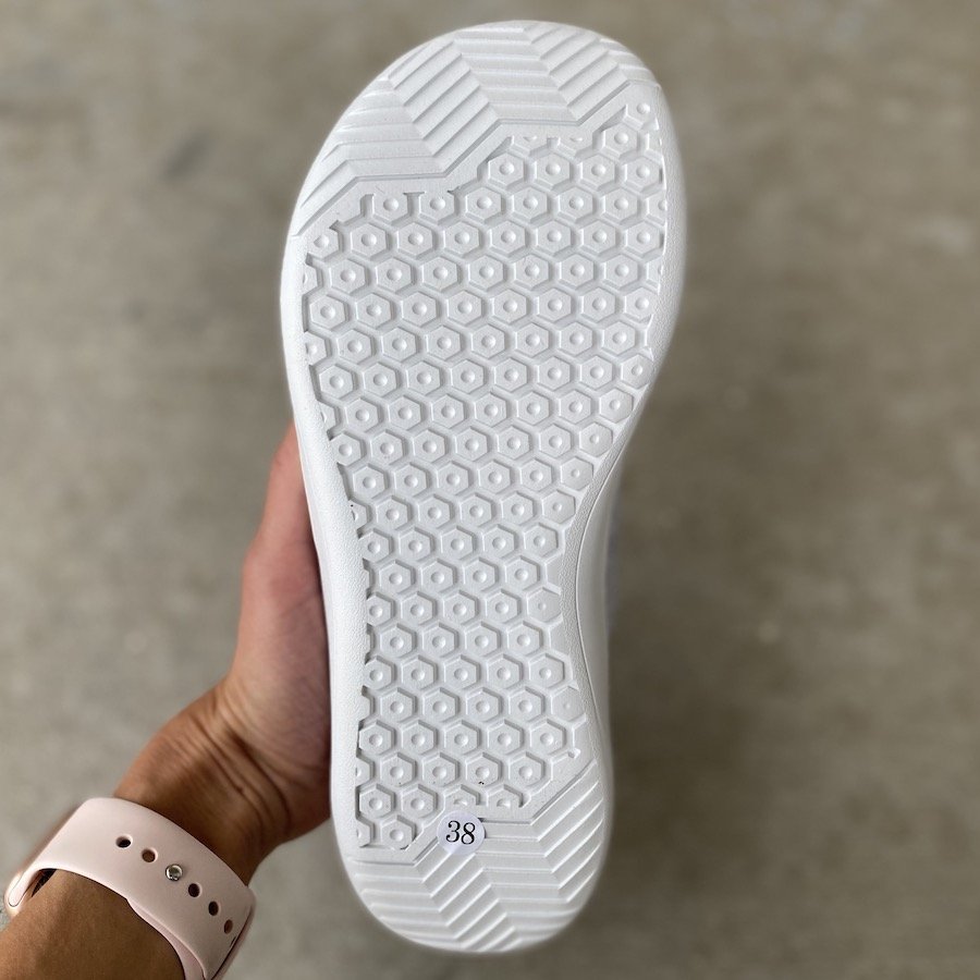 A close up of the outsole of a Whitin Barefoot shoe in wide to show it's natural foot shape and wide toe box