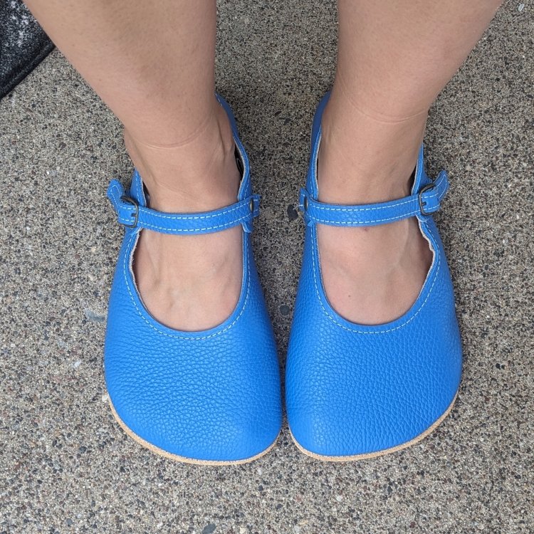 Top down close up of blue hidden seam mama janes from everleigh meadow, handmade barefoot shoes in fun colors for women with extra wide feet