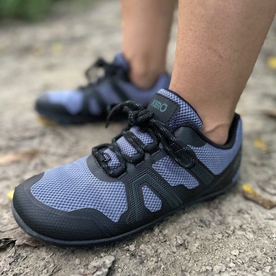 Front Angled close up of Barefoot Hiking Xero Shoes Mesa Trail WP being worn on a dirt path