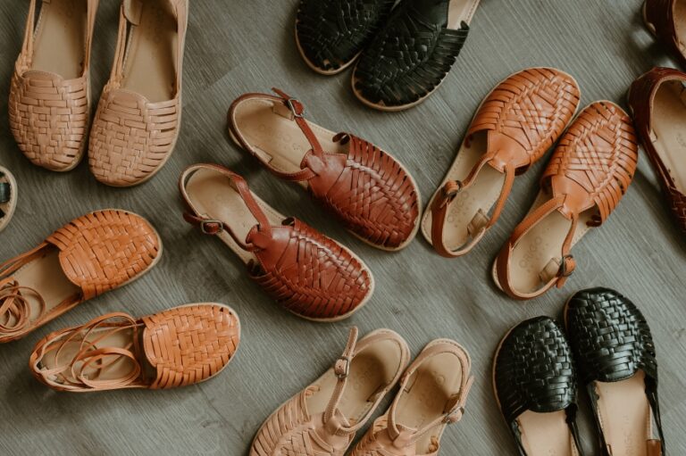 A collection of Origo Huarache slip-on and sandals woven from non toxic vegetable tanned leather. In multiple neutral brown and black shades.