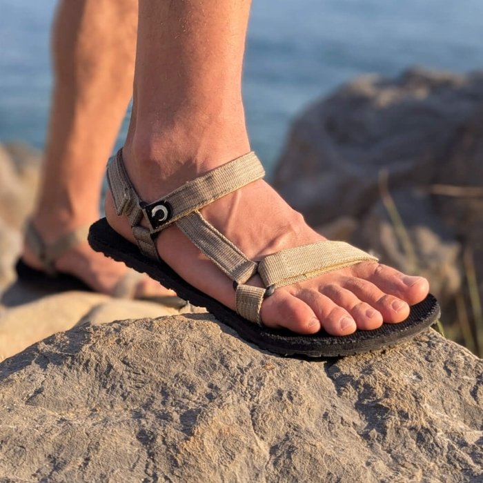 ZuZu Dirft barefoot sandals without a toe post being worn on a rocky hike