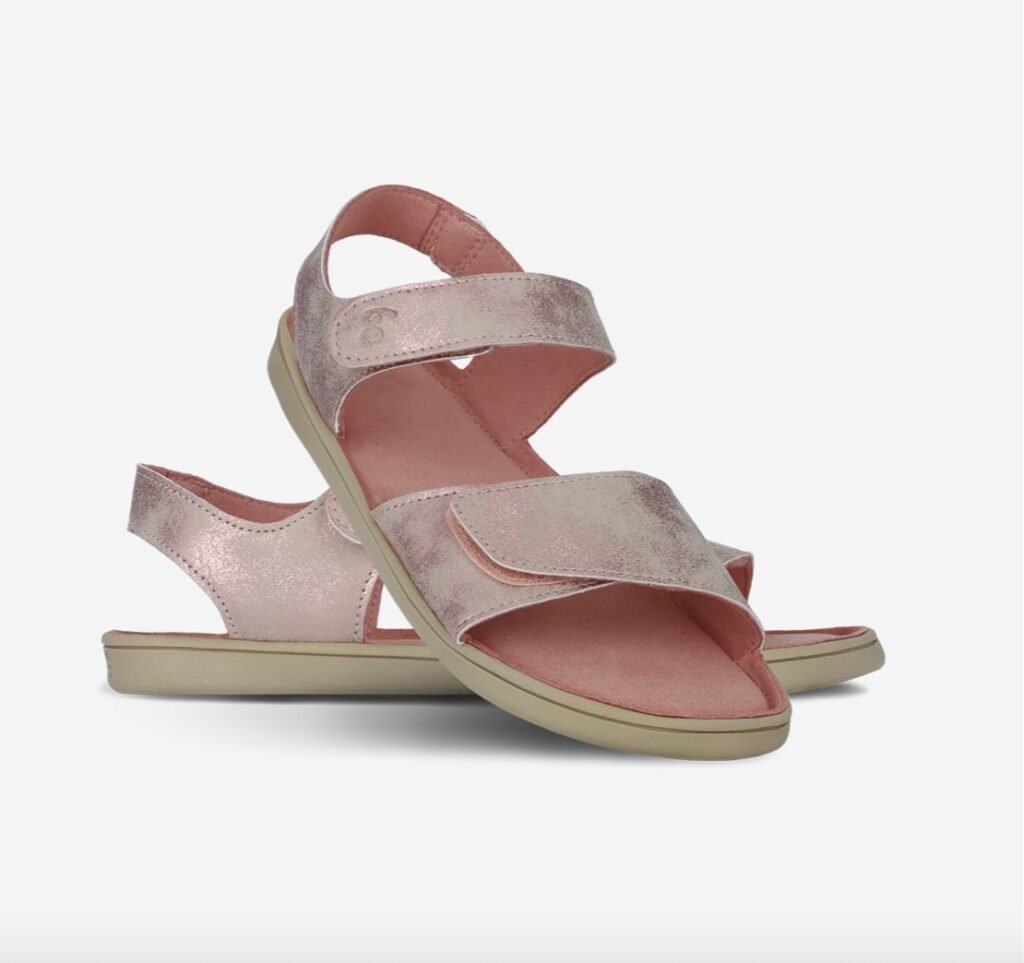 A product image of the kids Be Lenka Miami barefoot sandals in a vegan pink metallic material