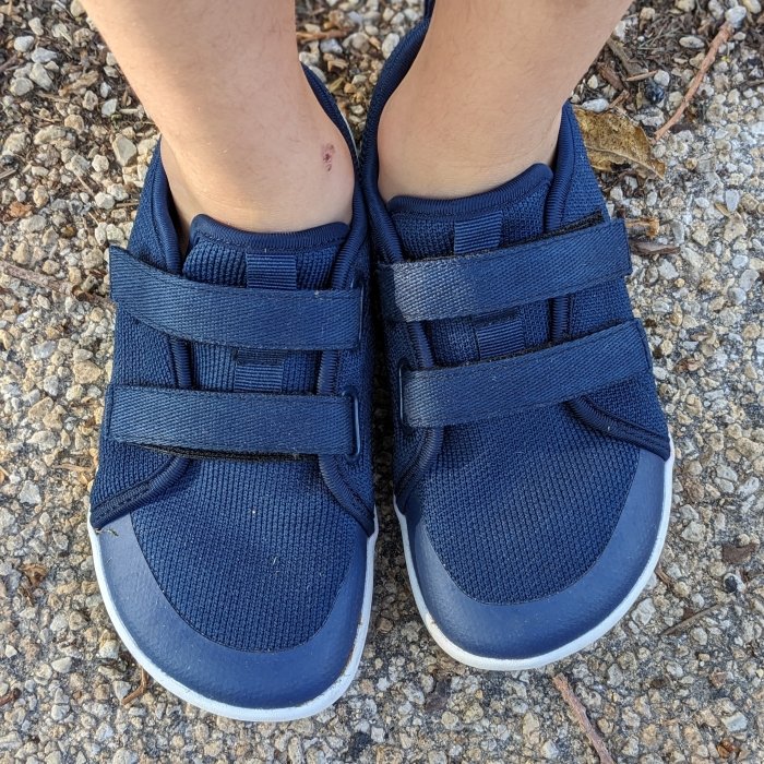 Top down view of a pair of navy blue mesh velcro wide toe box sneakers for kids from Whitin on Amazon, a cheap barefoot shoe brand