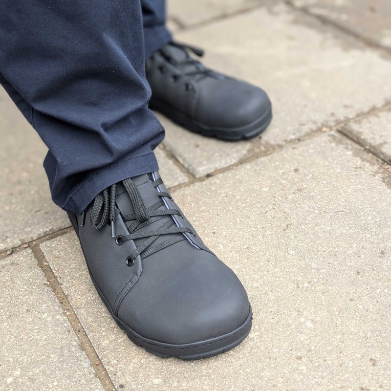 Close up view of the toe box and top of Gaucho Ninja sneaky Ninja safety shoes in vegan material with steel toe