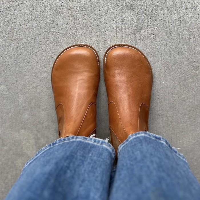 Top down view of Lang S. Tikki Shoes Luna wide toe box chelsea boots. Wide leg denim is visible above the ankle opening, and the stitching follows the anatomical toe box