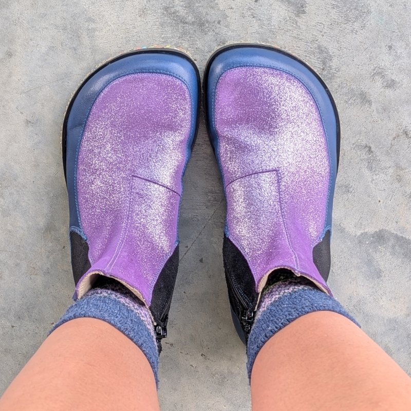 Top down view of extra wide toe box barefoot chelsea boot from Annika Barefoot in a shimmery purple and navy combination.