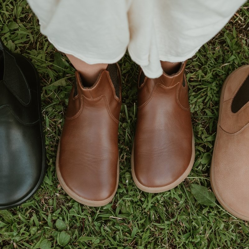 Be Lenka Entice in dark brown shown from the top down on a person with extra wide feet wearing a flowy cream dress