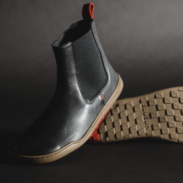 A stock image of a pair of black leather barefoot chelsea boots from Blusun
