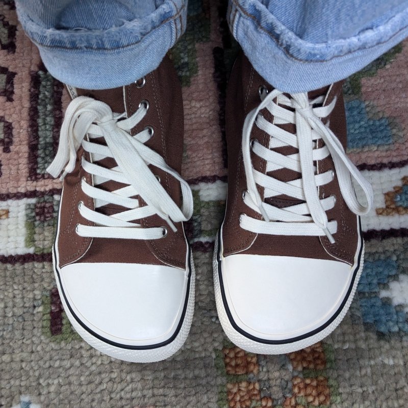 Close up of a pair of brown high tops from Bohempia with an extra wide toe box that have the look of Converse, but more toe space