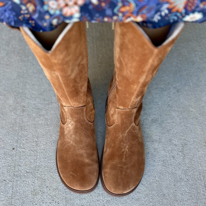 A pair of tall suede barefoot riding style boots shown from the top down to highlight the anatomical toe box. Groundies Tuscon is a barefoot soft suede boot.