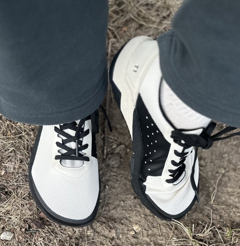 A top down view of a pair of Notace barefoot hiking shoes with an extra light construction and wide toe box