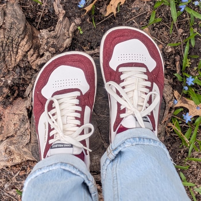 Top down view of a pair of Ohne Project 080 Wide sneakers with an extra wide anatomical toe box standing on an outdoor path.