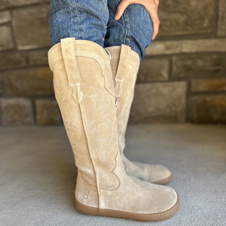Side profile view of Shapen Arizona western inspired tall suede boots with stitching details and top loops.