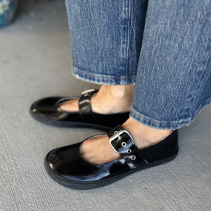 Side close up of Shapen Coco mary jane patent flats with chunky buckle detail and a flat flexible outsole