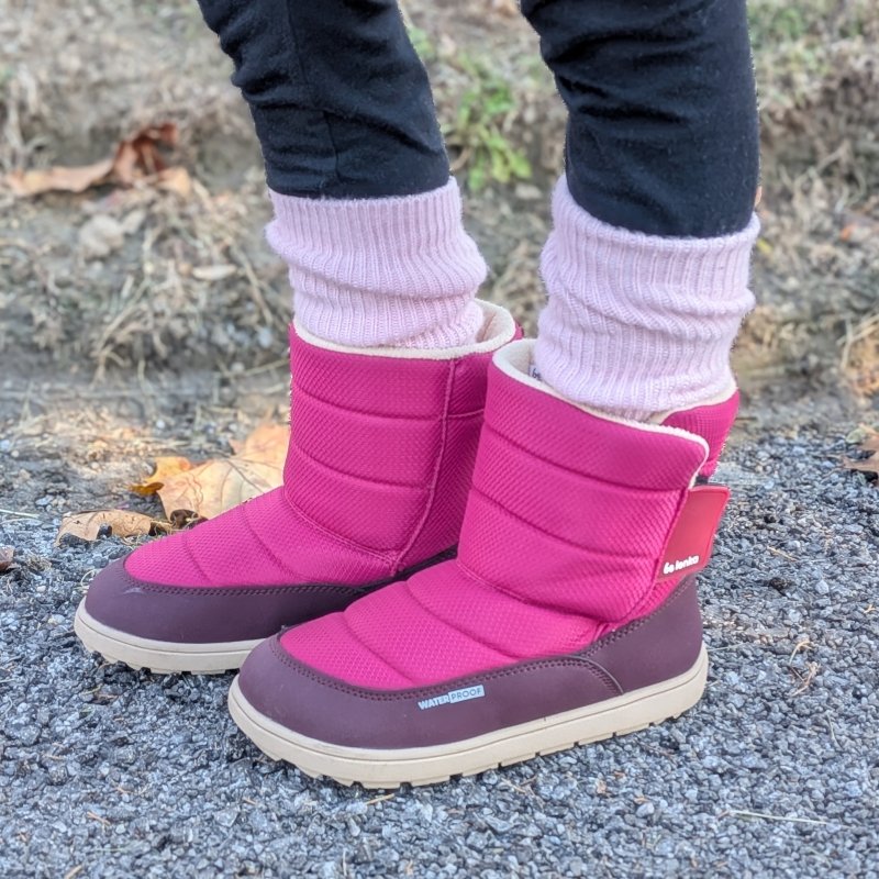 Close up of a pair of Waterproof winter barefoot snow boots from Be Lenka. The Ailo boot has a extra wide toe box, velcro closure, and flat outsole