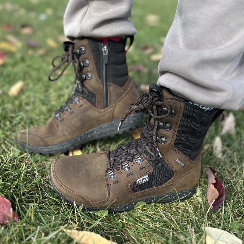 Close up of a pair of Lems Breck Insulated barefoot winter boots with a zipper,wide toe box, and zero drop outsole