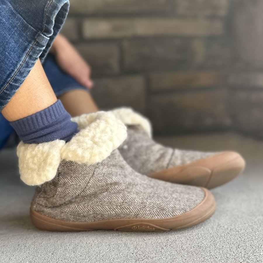 Close up of a pair of Wildling Shoes Koesling, a wool pull on barefoot cozy boot with a wide toe box, and sustainable materials.