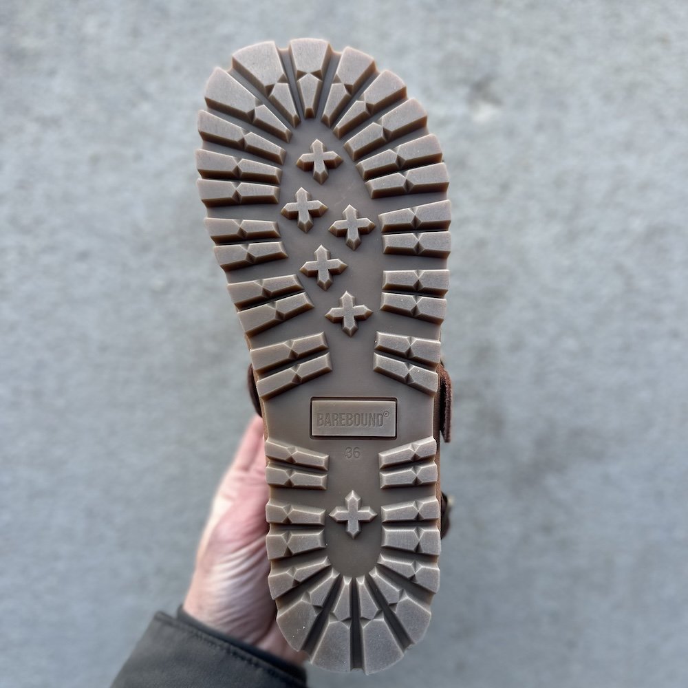 A close up of the outsole shape on a Barebound Ikarus barefoot clog. The wide toe box and narrower heel are easy to distinguish.