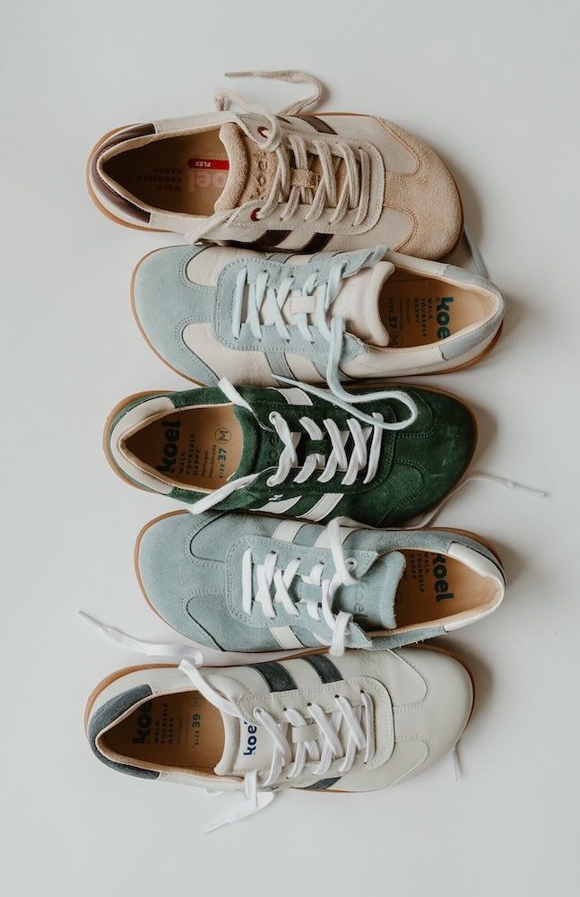 A line of one shoe of each colorway of Koel Ila alternating positions so the .wide toe boxes are up and down.