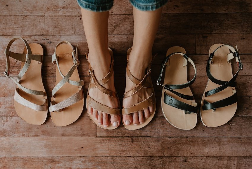 A line of Lang. S Selene barefoot strappy sandals in light, medium, and dark colors. They all sport a wide toe box and flat flexible outsole.