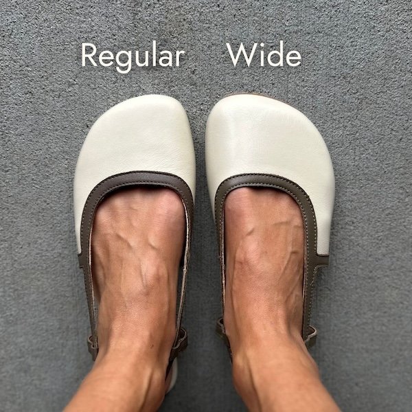 A top down view of a pair of feet wearing two different widths of Shapen Barefoot Twiggy beige and brown