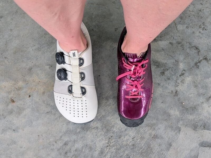 top down view of a person wearing 1 conventional cycling shoe and 1 Strong Feet Athletics Leviathan Cycling shoe to shoe the large difference in toe box width