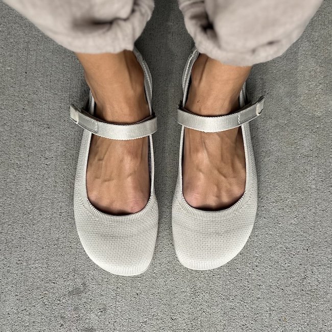 Top down view of a pair of Xero Cassie Knit Mary Janes in a beige color.