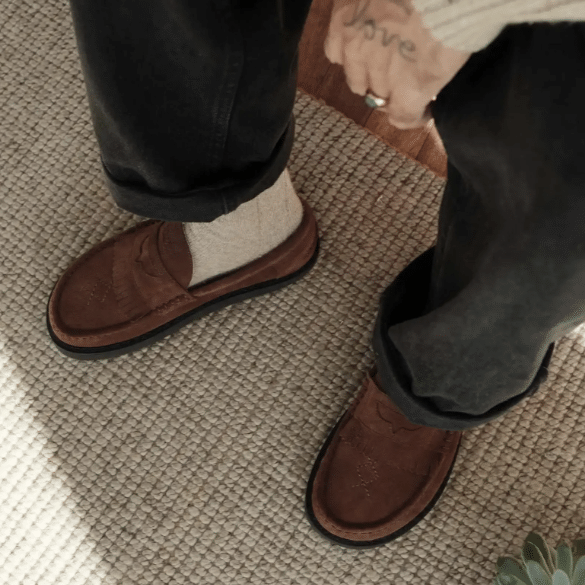 Top down view of a person in Dolfie Paradise Duke 2 barefoot loafers with fringe, stitching details, and a wide toe box.