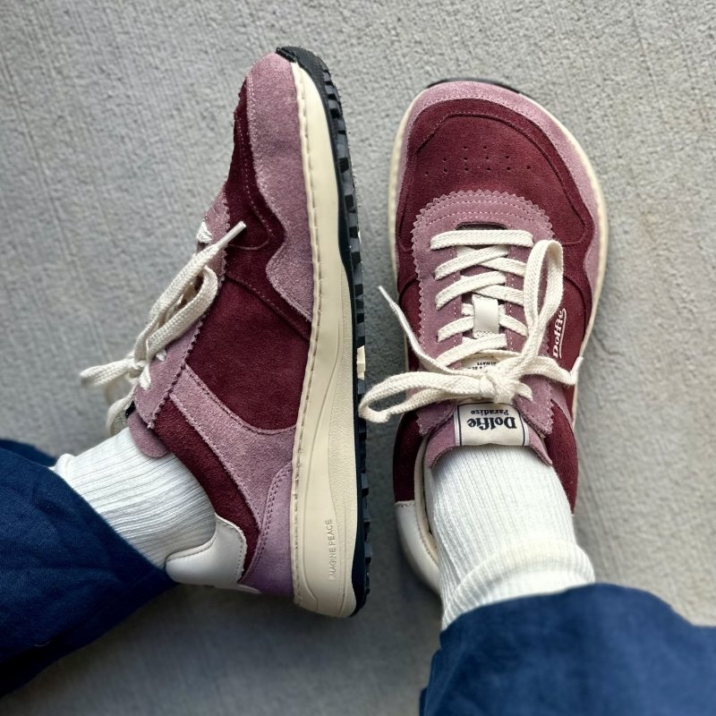 Top down and side close up view of a person in burgundy sneakers from Dolfie Paradise. The Supersonic model is shown with a wide toe box, and zero drop outsole with cushioning.