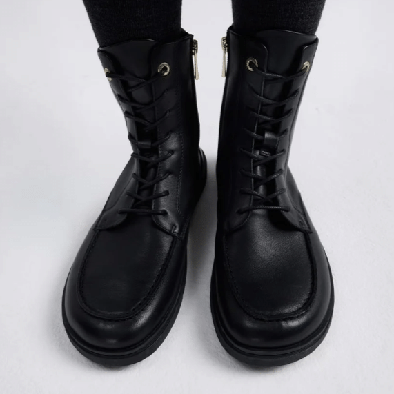 Stock front view of a pair of Groundies Adelaide Barefoot combat boots with a moc toe.